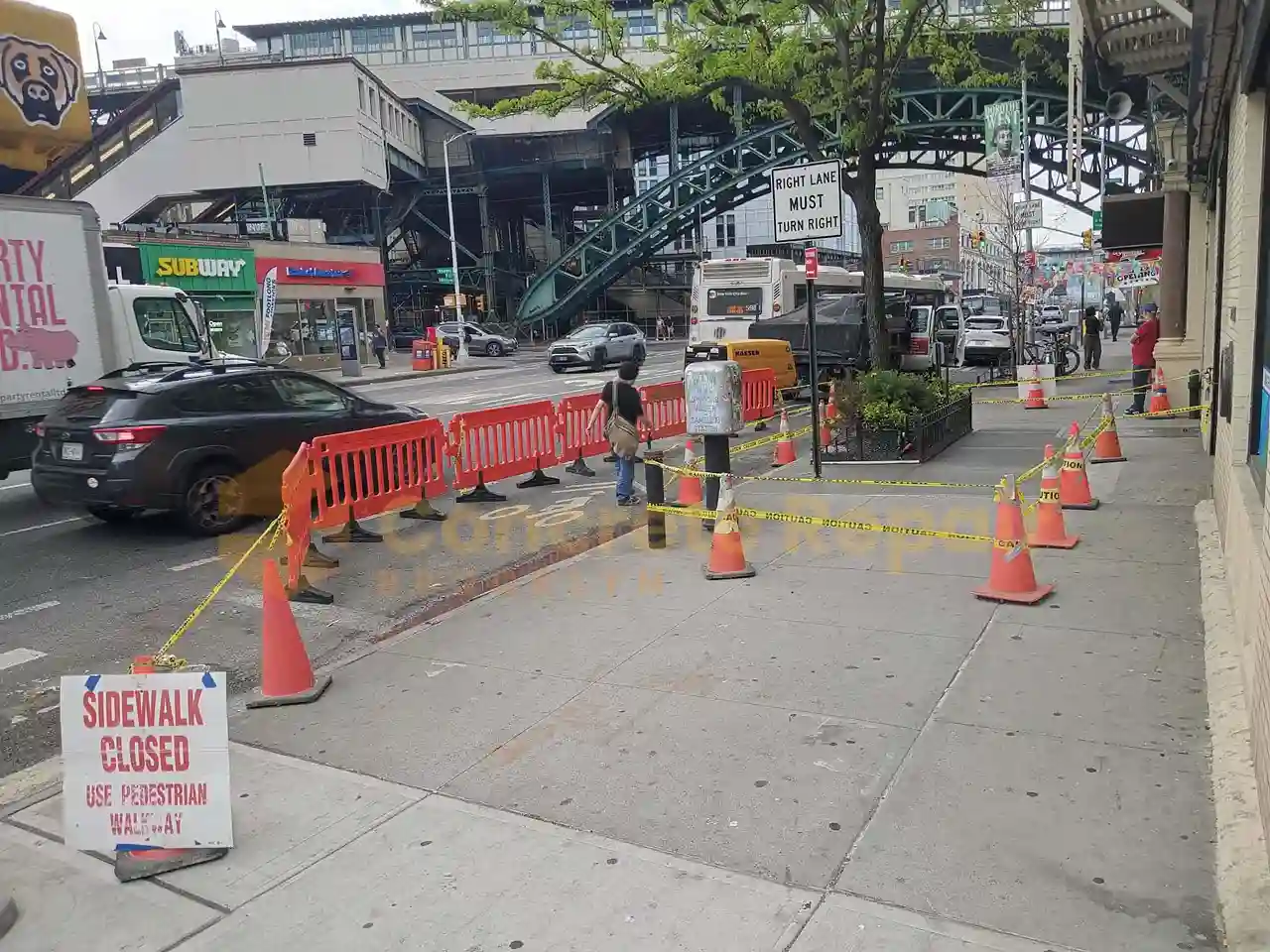 A man uses a concrete tamper to smooth and lay out a stamped concrete floor.